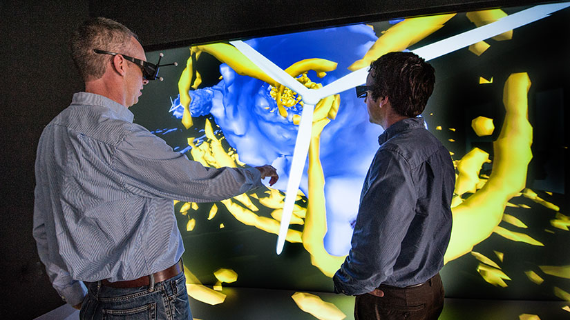 wind-atmospheric-science-fullwidth-31412 Two people wearing VR headsets looking at wind turbine on screen