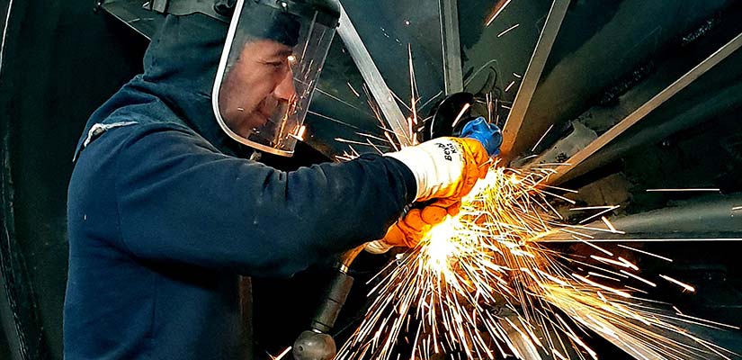 workforce-development Man welding a turbine.