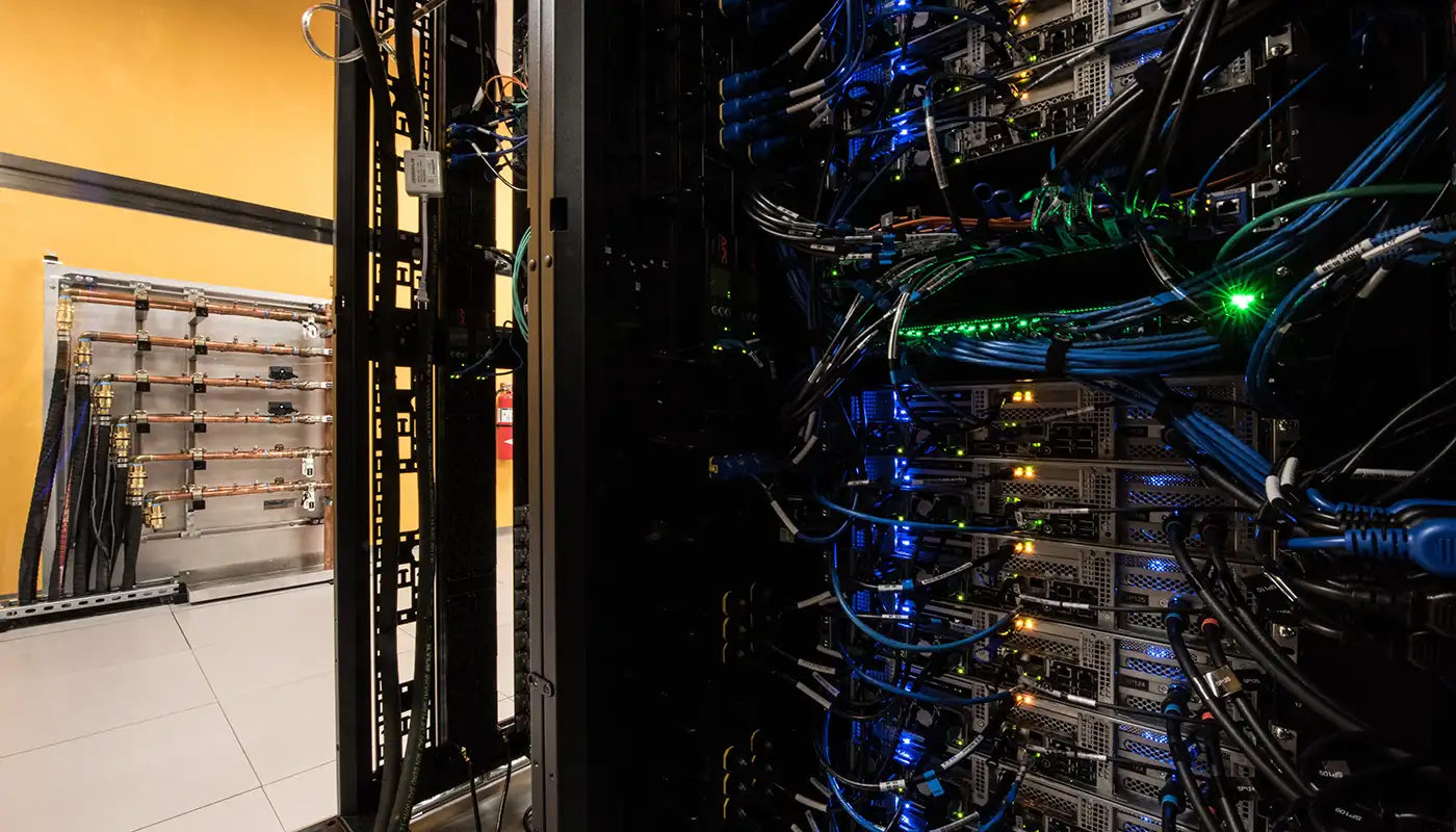 fac_42014 Photo of hot aisle containment manifolds in data center