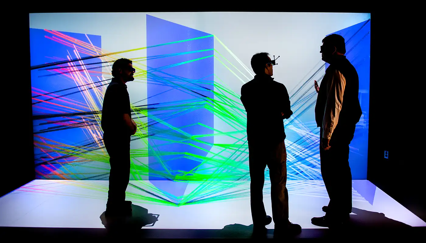 fac_33710 Photo of three people viewing a large-scale 3D visualization