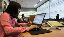 policy-market-51368-cap Researcher working on a laptop.
