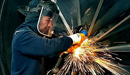 workforce-development-cap Man welding a turbine.
