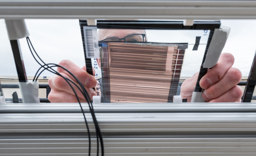 A person placing a PACT minimodule in place. 