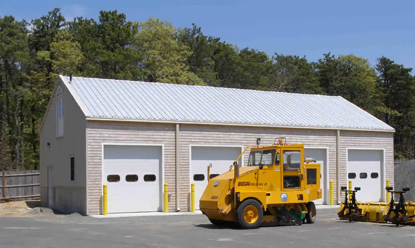 edgartown-ma-bdy A street sweeper in front of a four-door garage.