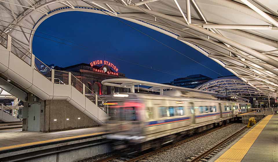 tsdc-15th-anniversary-71818-flt A train moving through a train platform at Denver's Union Station.